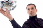 Man Showing Disco Shiny Ball Stock Photo