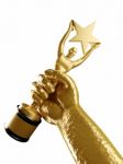 Star Award In Golden Hand Stock Photo