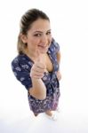 High Angle View Of Young Girl Showing Thumb Up Stock Photo