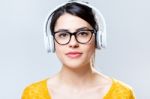 Beautiful Brunette Woman Listening To Music Stock Photo