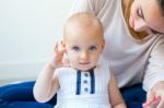 Baby Girl And Her Mother Playing At Home Stock Photo