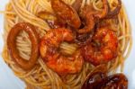 Italian Seafood Spaghetti Pasta On Red Tomato Sauce Stock Photo