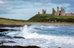 View Of Dunstanburgh Castle At Craster Northumberland Stock Photo