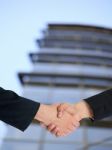 Handshaking Business People Stock Photo