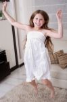 Young Little Girl Jumping Stock Photo