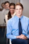 Business People Sitting In Meeting Room Stock Photo