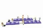 Miniature Worker Team Building Word Happy New Year On White Background Stock Photo