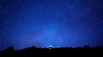 Milky Way And Silhouette Of Tree On Top Of Mountain, Long Exposu Stock Photo