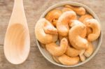 Cashew Nut Roast Salt On Weathered Wooden Table Stock Photo