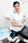 Dentist Posing In Dental Clinic Stock Photo