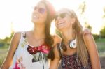 Young Beautiful Girls Having Fun In The Park Stock Photo