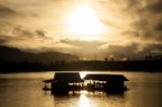 Silhouettes Of River Rafting Stock Photo