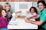 Happy Family Enjoying Dinner Stock Photo