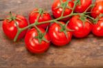 Fresh Cherry Tomatoes On A Cluster Stock Photo