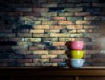 Colorful Tiffin Carrier On Wooden Cupboard With Blurred Vintage Stock Photo