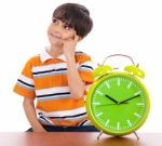 Boy With Alarm Clock Stock Photo