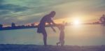 Mother And Daughter On Sunset Watching On Sky Stock Photo