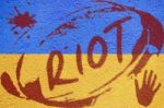 Ukraine Flag Painted On Old Concrete Wall With Riot Inscription Stock Photo