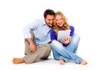 Couple Using Digital Tablet Stock Photo