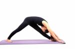 Portrait Of Asian Woman Wearing Black Body Suit Sitting In Yoga Meditation Position Isolated White Background Stock Photo