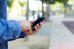 Modern Young Man With Mobile Phone In The Street Stock Photo