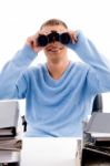 Young Professional Looking Through Binocular Stock Photo