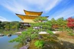 Kinkakuji Temple At Autumn Against Blue Sky Stock Photo