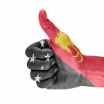 Flag Of Papua New Guinea On Thumb Up Hand Stock Photo