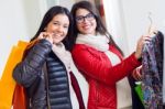 Two Beautiful Girls Shopping In A Clothes Shop Stock Photo