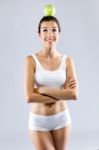 Beautiful Young Woman In White Underwear Holding Green Apple Stock Photo