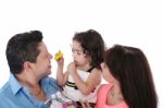 Dad, Wife And Daughter In The Studio On A White Background.  Foc Stock Photo