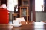 White Coffee Cup On Wooden Table Stock Photo