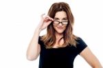 Beautiful Woman Holding Her Eyeglasses Stock Photo