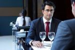 Two Smiling Business Men Have Dinner At Restaurant Stock Photo