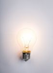 Light Bulb With Drawing Graph Stock Photo