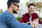 Two Young Entrepreneurs Working At Coffee Shop Stock Photo