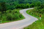 Curve Road With Sign Post Stock Photo