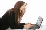 Girl Relaxing On Bed With Laptop  Stock Photo