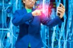 People Use Smart Phone In Datacenter Room Stock Photo