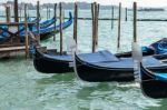 Gondolas Moored At The Entrance To The Grand Canal Stock Photo