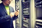 Man Fix Server Network In Data Center Room Stock Photo