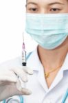 Female Doctor And Syringe Stock Photo