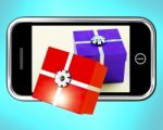 Gift Boxes On Mobile Screen Stock Photo