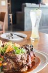 Delicious Barbecued Ribs And Lemon Soda Drink Stock Photo