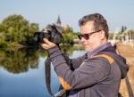 Elderly Man Photographs The Landscape Stock Photo