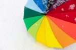 Colorful Umbrella In The Fresh Snow Stock Photo