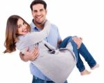 Cheerful Young Couple Piggybacking Stock Photo