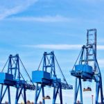 Blue Cargo Cranes At Sea Port Stock Photo