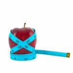 Red Apple With Tape Stock Photo