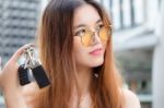 Portrait Of Thai Chinese Adult Beautiful Girl Denim Blue Bag And Key Stock Photo